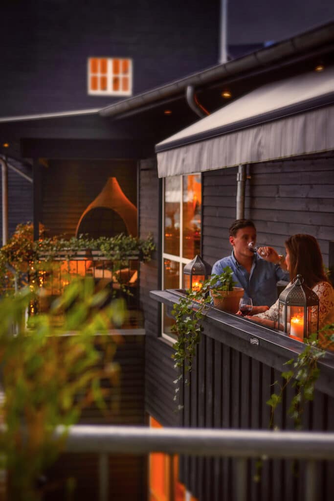 Restaurant interior with balcony at 66 Guldsmeden Hotel in Copenhagen
